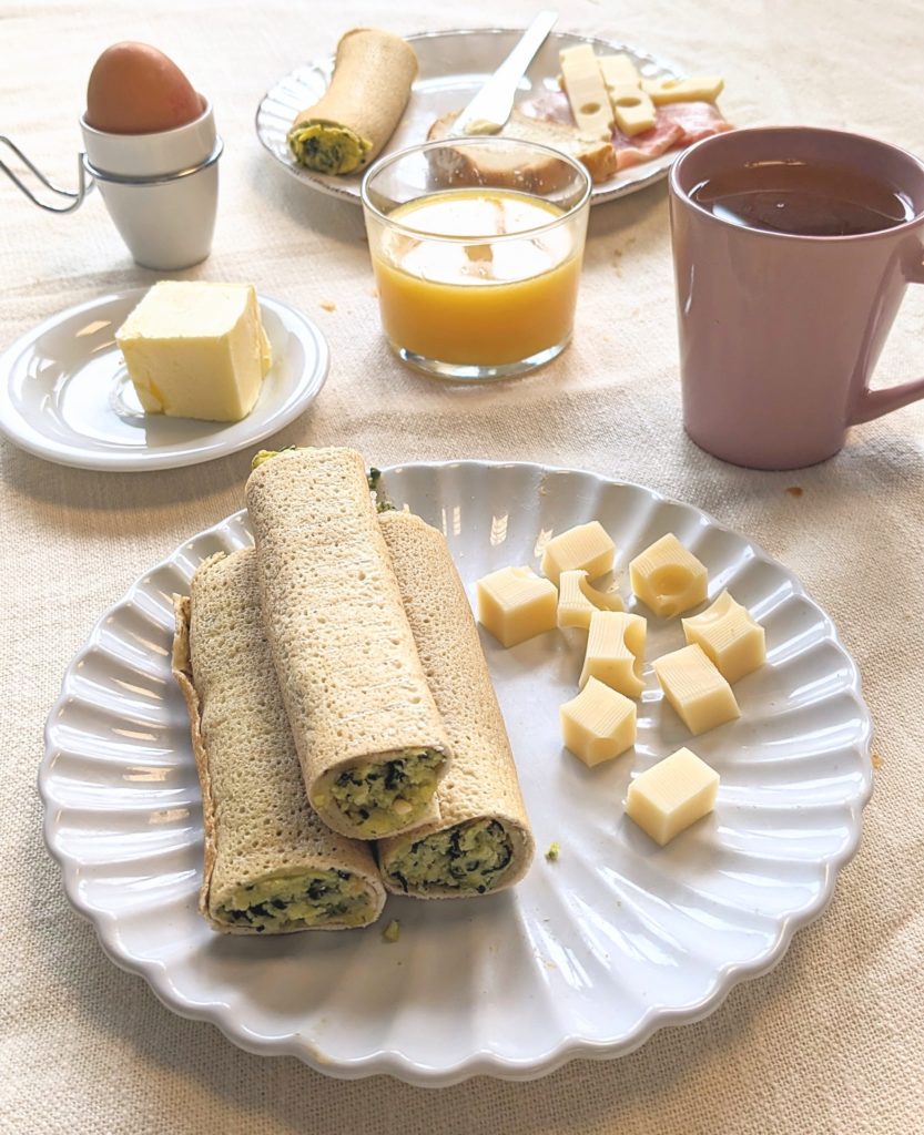 Breakfast with crêpes spinach egg and emmental